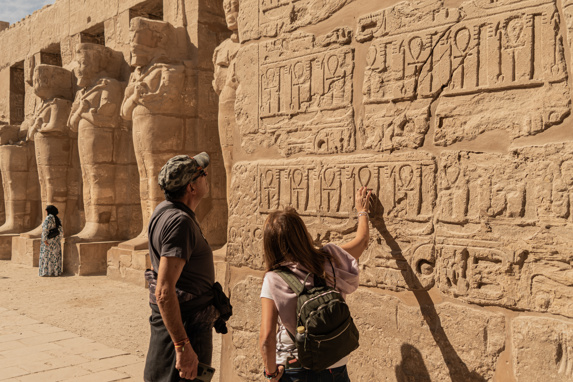 Man and woman visiting Karnak Temple in Luxor, Egypt