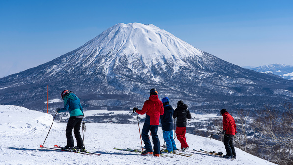 Group of skiers in Niseko ski resort, Japan